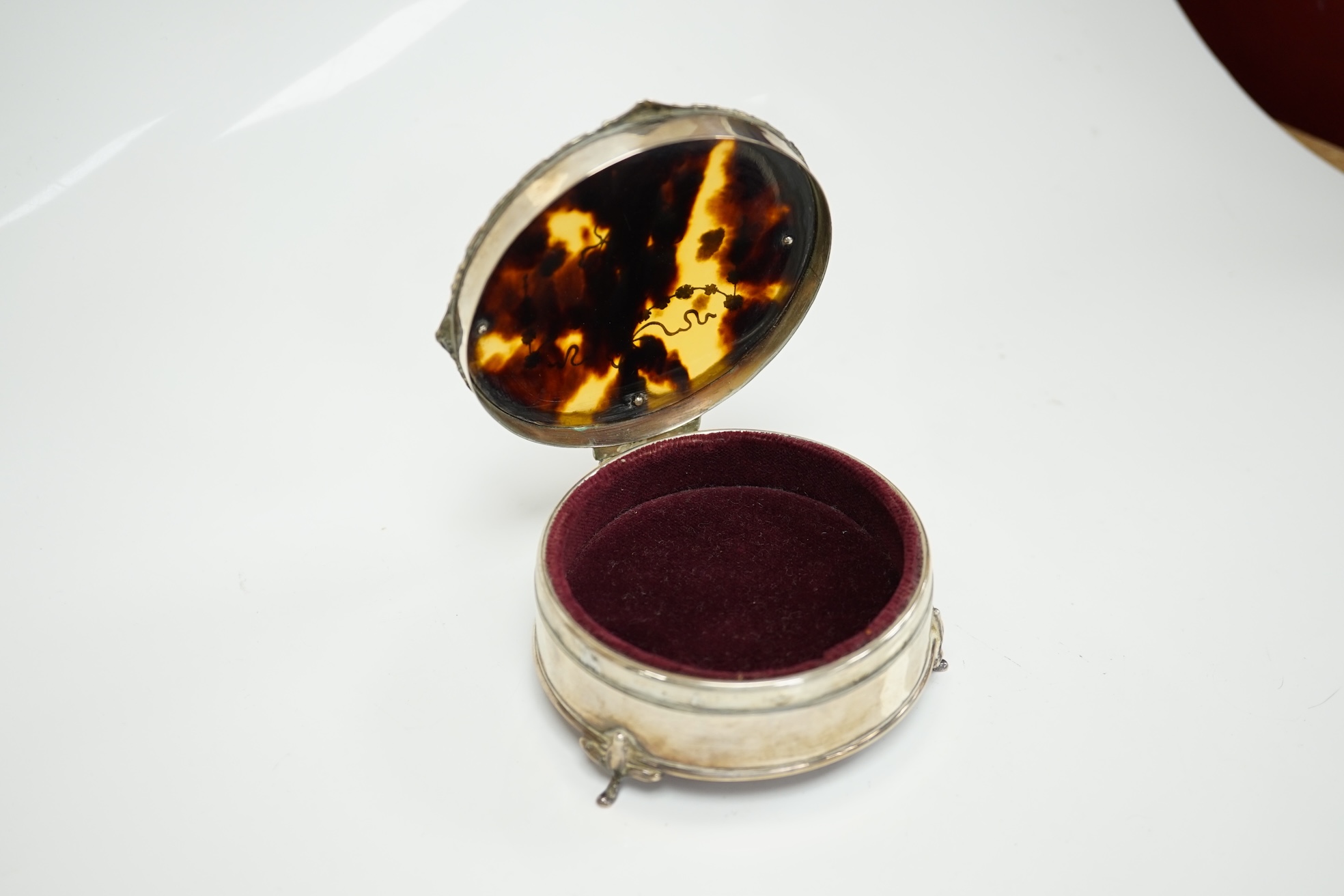 A George V silver and tortoiseshell pique mounted trinket box, by Mappin & Webb, Birmingham, 1918, circular diameter 94mm Condition - fair to good